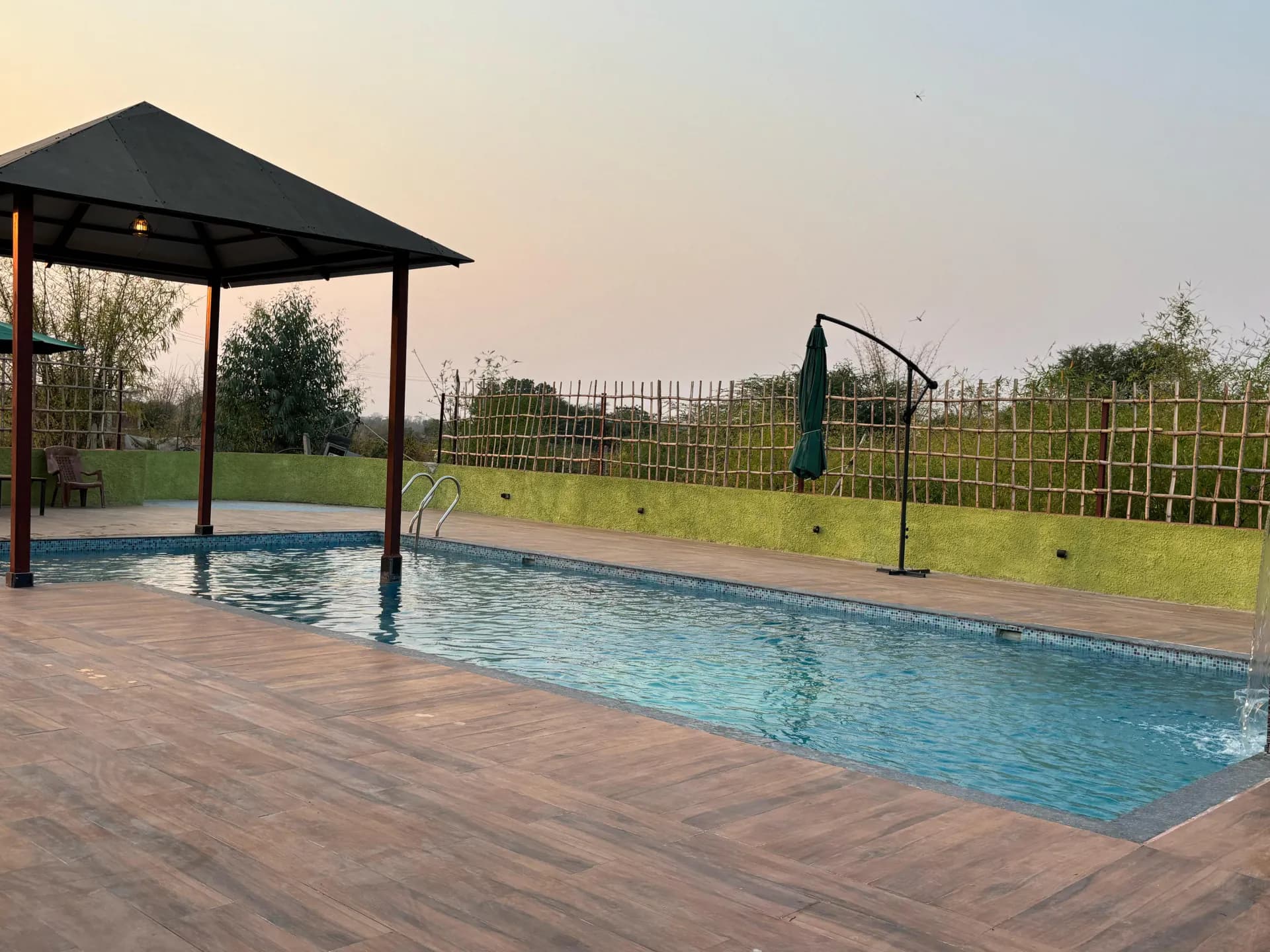 Swimming pool and gazebo at Tadoba Aranya Villa Resort, near Kolara gate